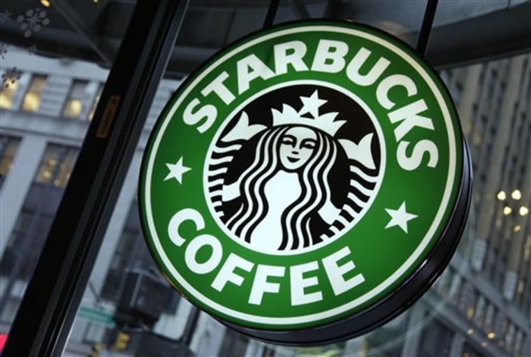 A sign in a Starbucks is displayed in New York's Times Square. Starbucks it will have packages of its Keurig coffee pods available at U.S. grocery stores and specialty retailers beginning in November.